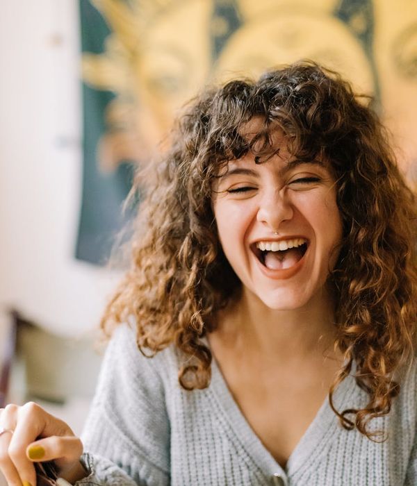 Woman with a vibrant aura feeling energetic and full of life.